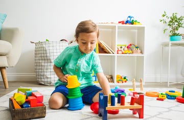 4 year old boy playing with building toys