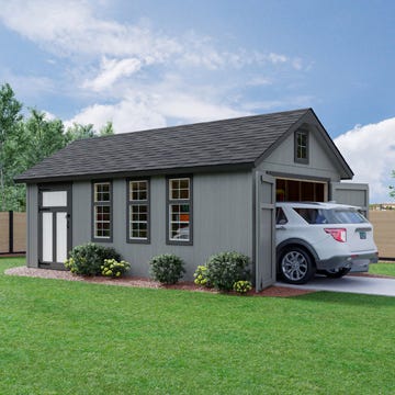 a modern garage with a car parked in front surrounded by greenery