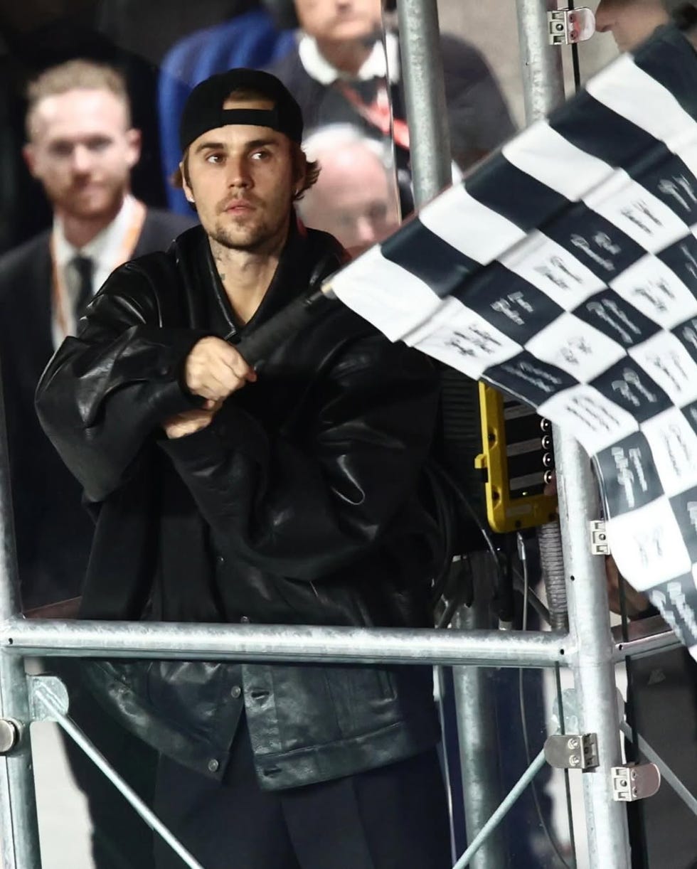 individual waving a checkered flag at an event