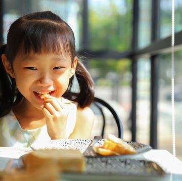 a girl eating breakfast