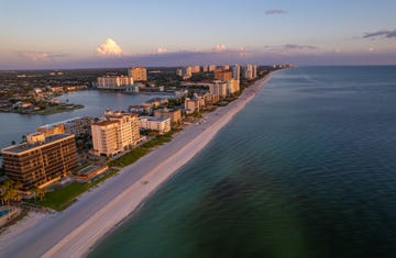 aerial drone photo naples vanderbilt beach florida, at sunset