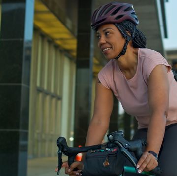 african american cyclist in downtown la in the evening