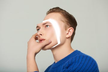 android man removing his face