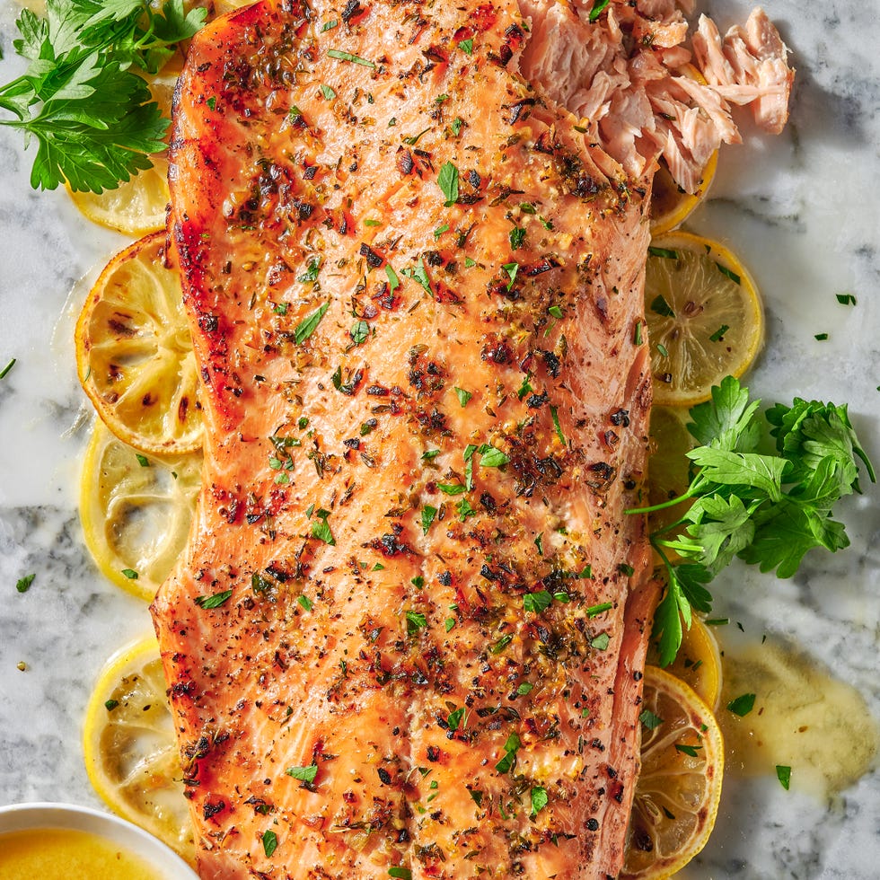 baked salmon with lemon slices and herbs