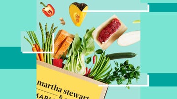 fresh vegetables, fruits, and other ingredients flying out of a food subscription box