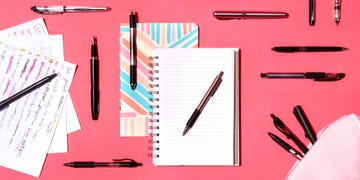 assortment of pens and notebooks