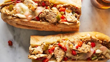 cheesesteaks filled with chicken, cheese, and peppers