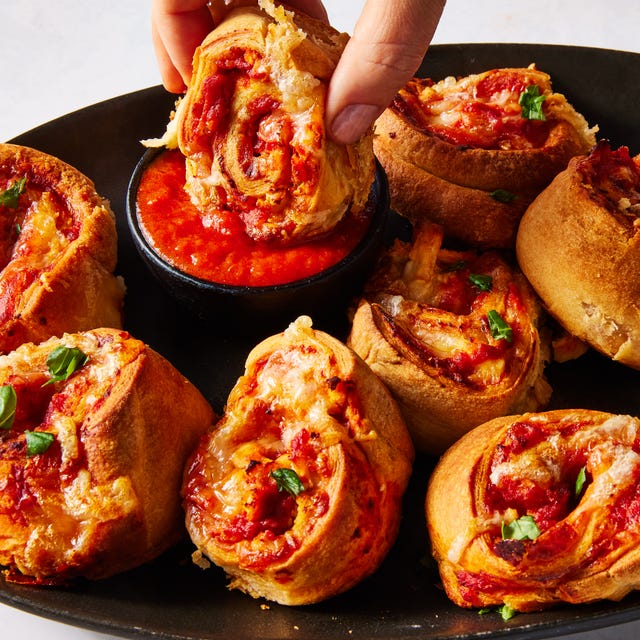 chicken parm pinwheels on a platter with marinara sauce