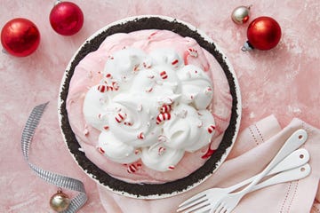 peppermint icebox pie festively decorated with whipped cream and crushed pepper candy