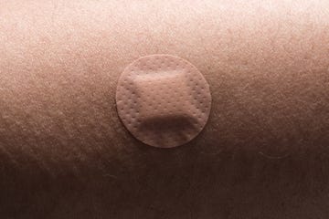 circle adhesive bandage on human skin