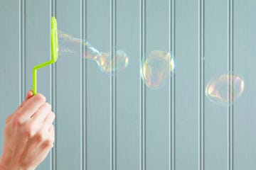 bubble wand blowing bubbles