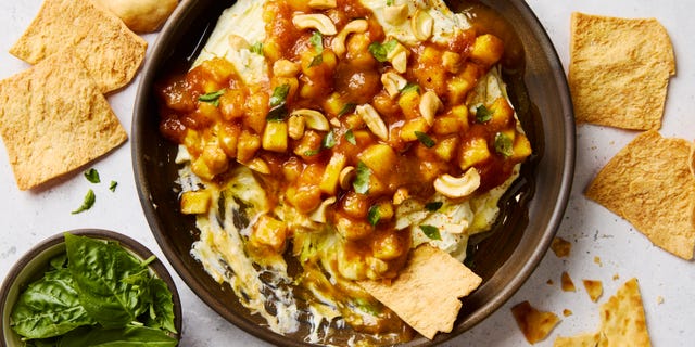 fluffy garlic and basil studded whipped goat cheese, spicy mango chutney, and salty chopped cashews served with pita chips