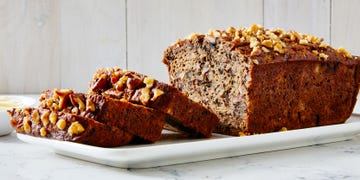 banana nut bread sliced on a white platter