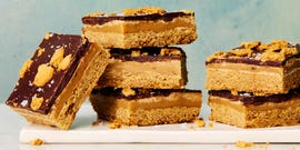 stacks of gingerbread millionaire shortbread bars