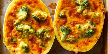 spaghetti squash stuffed with cheesy broccoli cheddar on a sheet pan