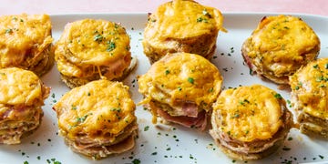 layers of russet potatoes soaked in fresh thyme, seasoned half and half, and parmesan layered thinly sliced ham and topped each with melty cheddar cheese