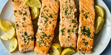 hearty salmon filets are generously seasoned with salt and pan seared in browned butter lemon zest and lemon juice, then topped with a flurry of freshly chopped herbs