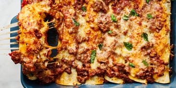 saucy beef bolognese, and herby ricotta rolled into flour tortillas and topped with more bolognese mozzarella and parmesan then baked until bubbly and perfect