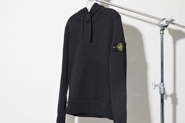 black hoodie displayed on a hanger