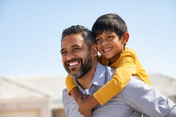 father son quotes smiling dad holding smiling son on his back