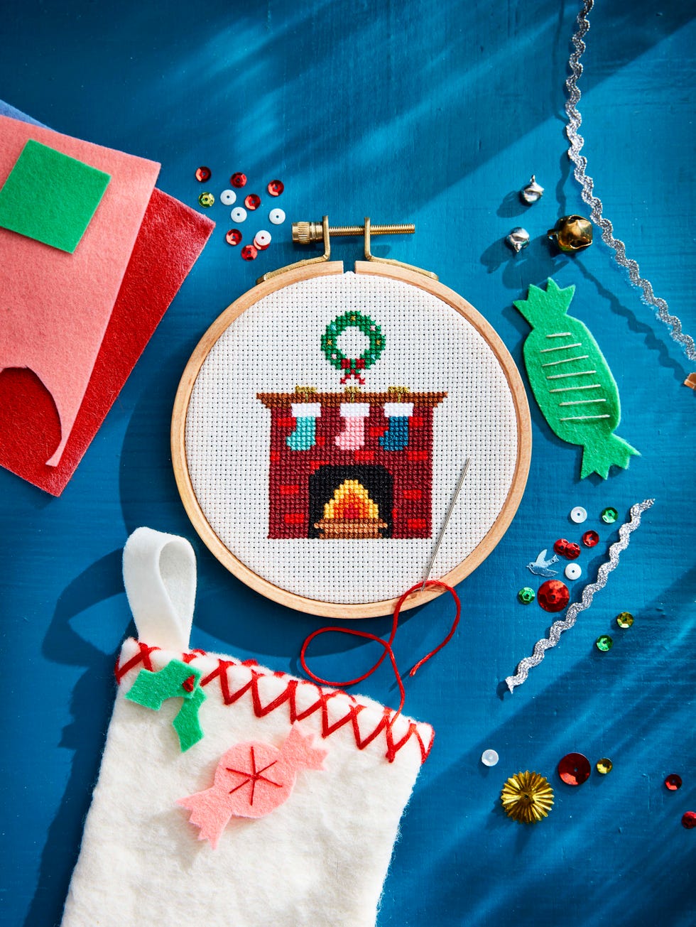 cross stitch fireplace with wreath and stockings