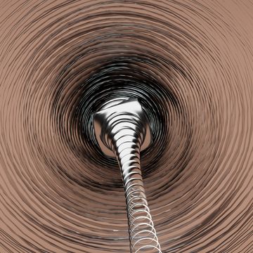 front view of a metallic vortex with the moving curves of an abstract background in the foreground