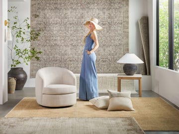 galey alix poses with her livabliss rug collection in a stylish living room featuring modern decor