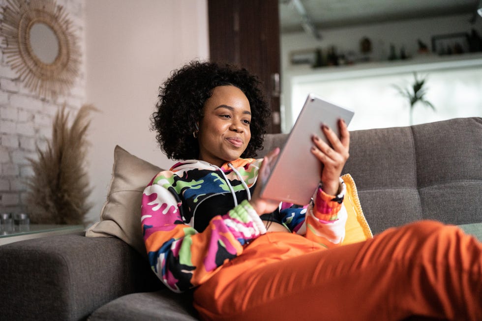 young woman using a digital tablet at home