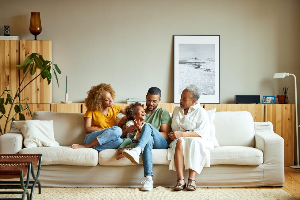 a family sitting on a couch together