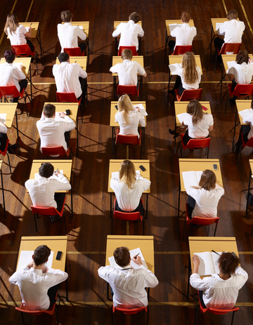 students seated in a classroom during an exam