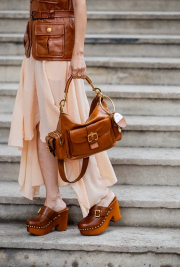 paris, france september 26 elva ni wears brown vest, golden necklace, skirt, brown bag, clogs outside chloe during womenswear springsummer 2025 as part of paris fashion week on september 26, 2024 in paris, france photo by christian vieriggetty images