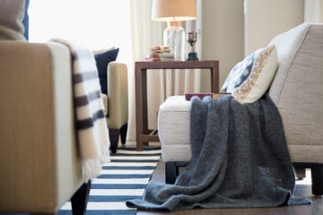 Gray blanket over chair in elegant living room