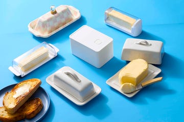 various butter dishes and butter spread with toasted bread