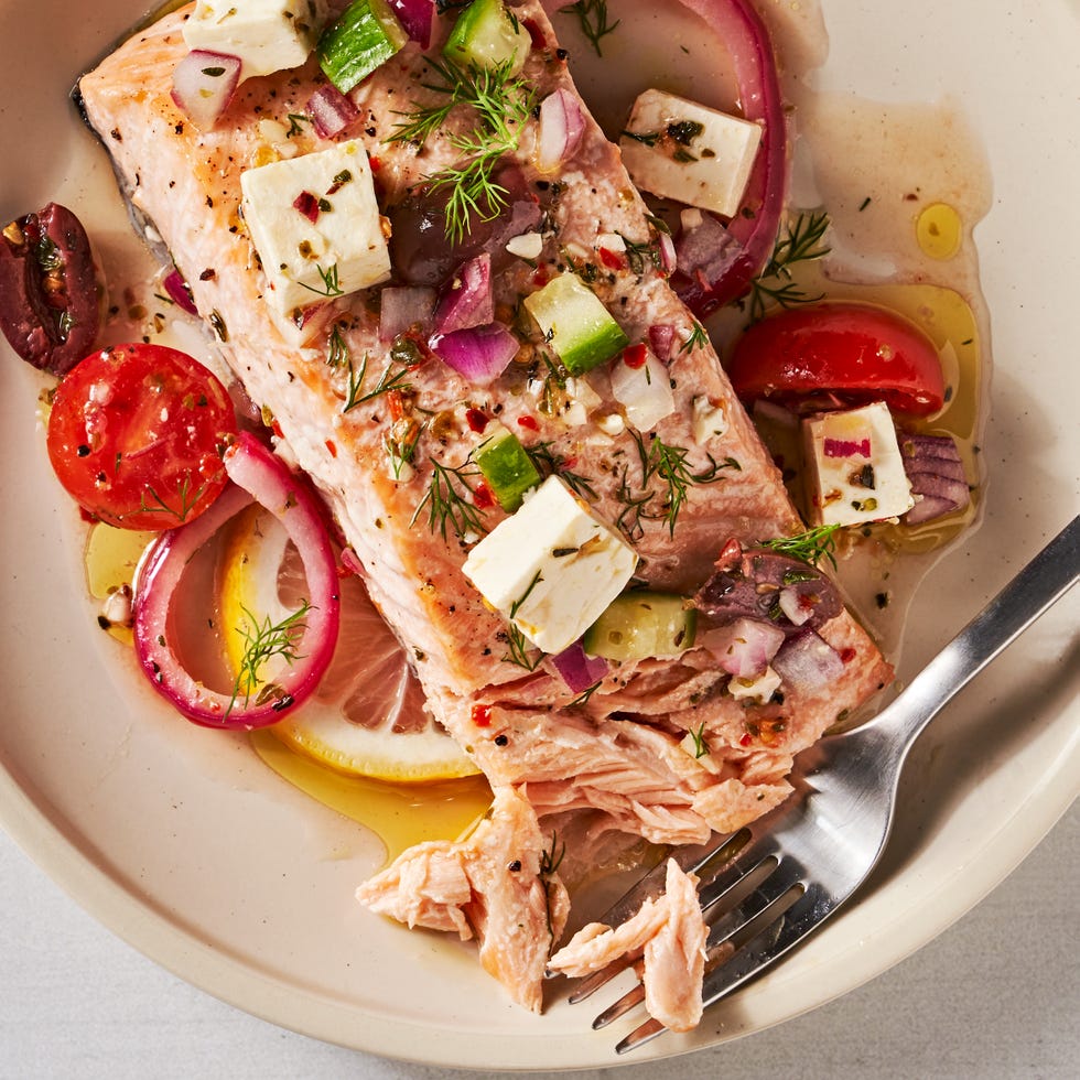 greek salmon with feta, tomatoes, lives, red onion, and cucumber