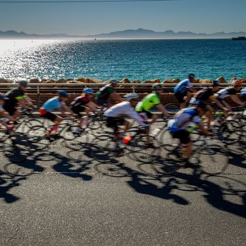 group of blurred riders in a mass participation cycle race