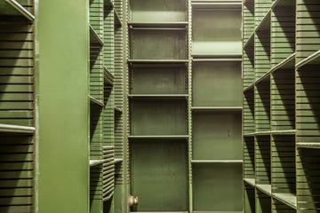 old empty green shelves in a library usa