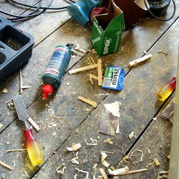 hand tools scattered on floorboards in a house