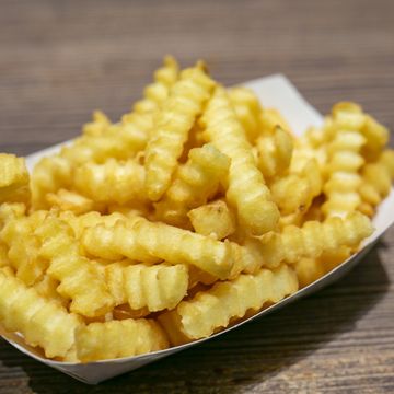 heap of french fries in a box