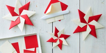 red and white crafted waldorf stars on a white surface