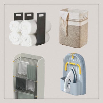 home organization items including towels a storage bin a drying rack and an iron with its holder