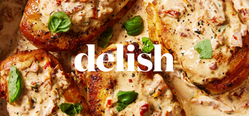 cooked chicken with delish logo on top