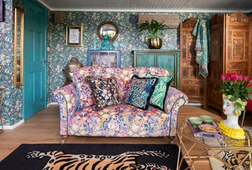 maximalist garden room with william morris clashing wallpaper and fabrics