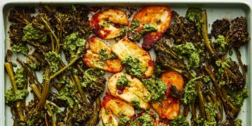 roasted halloumi and broccolini with a pesto sauce on a sheet pan