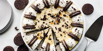 oreo cheesecake topped with whipped cream and oreos