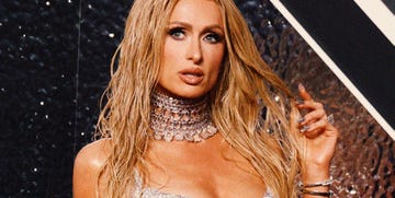 paris hilton wears an intricate necklace and chainmail shiny dress