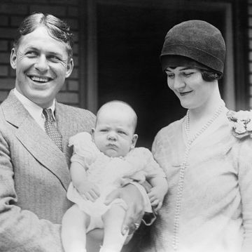 vintage man and woman holding baby