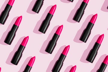 pink lipsticks, lip gloss on trendy pastel background cosmetic products makeup accessories skin care beauty 3d pattern