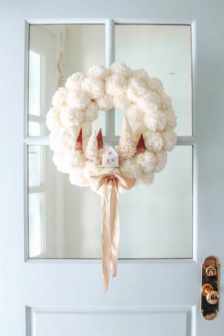 pom pom village, diy christmas wreath ideas