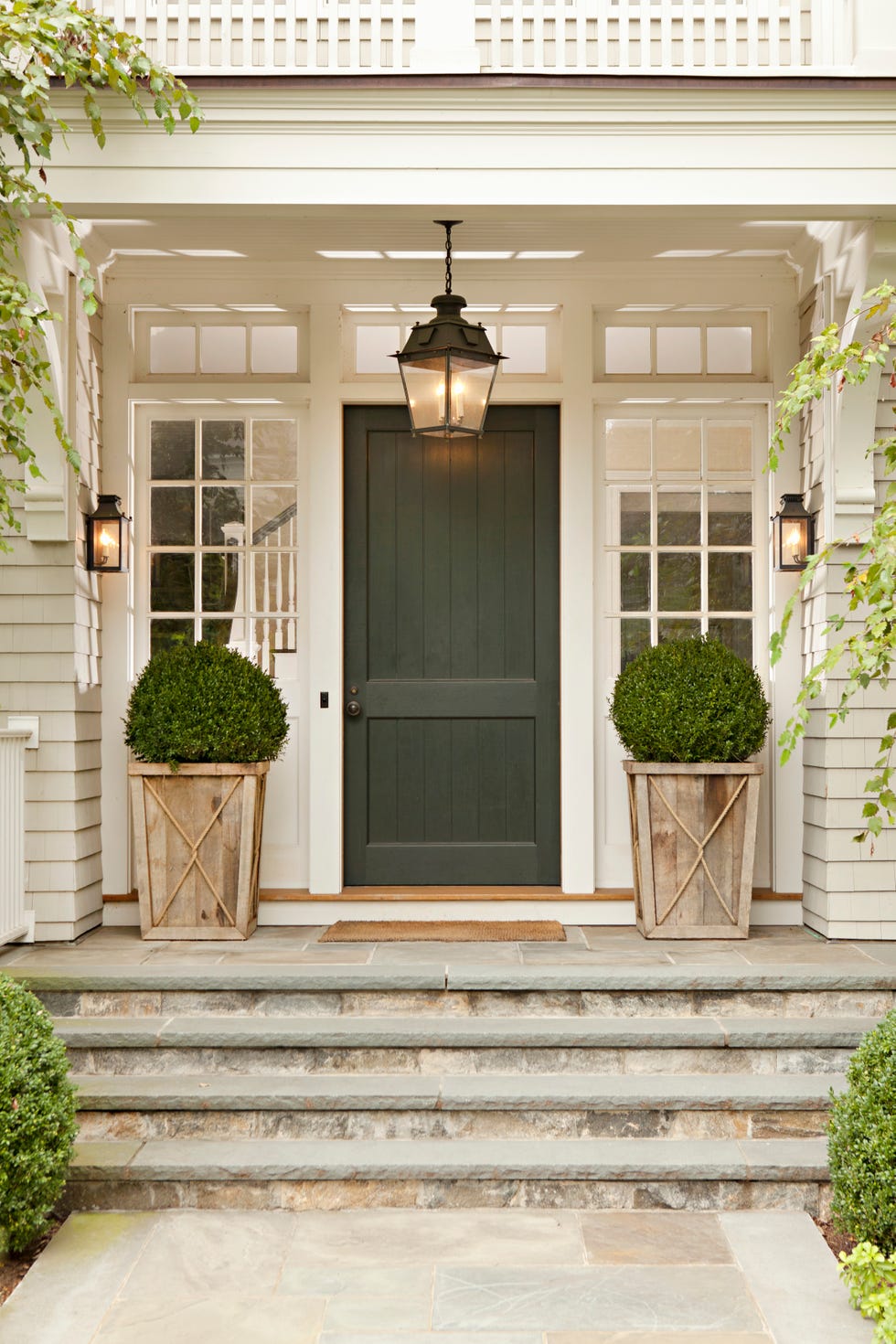 close up of green, wooden front door of county home