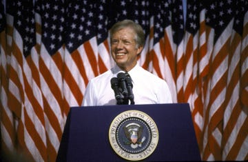 president jimmy carter speaking at podium at merced college